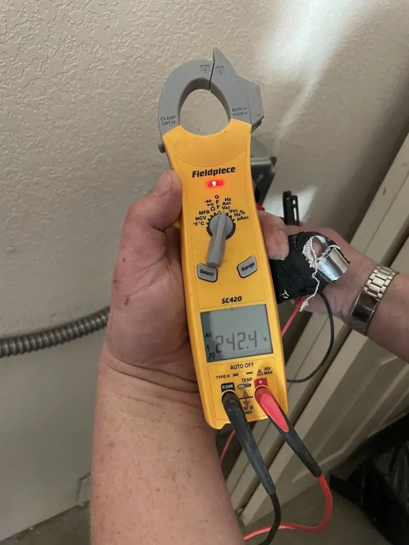 Voltage testing with clamp meter during Ceiling Fan Installation in Broadview Heights